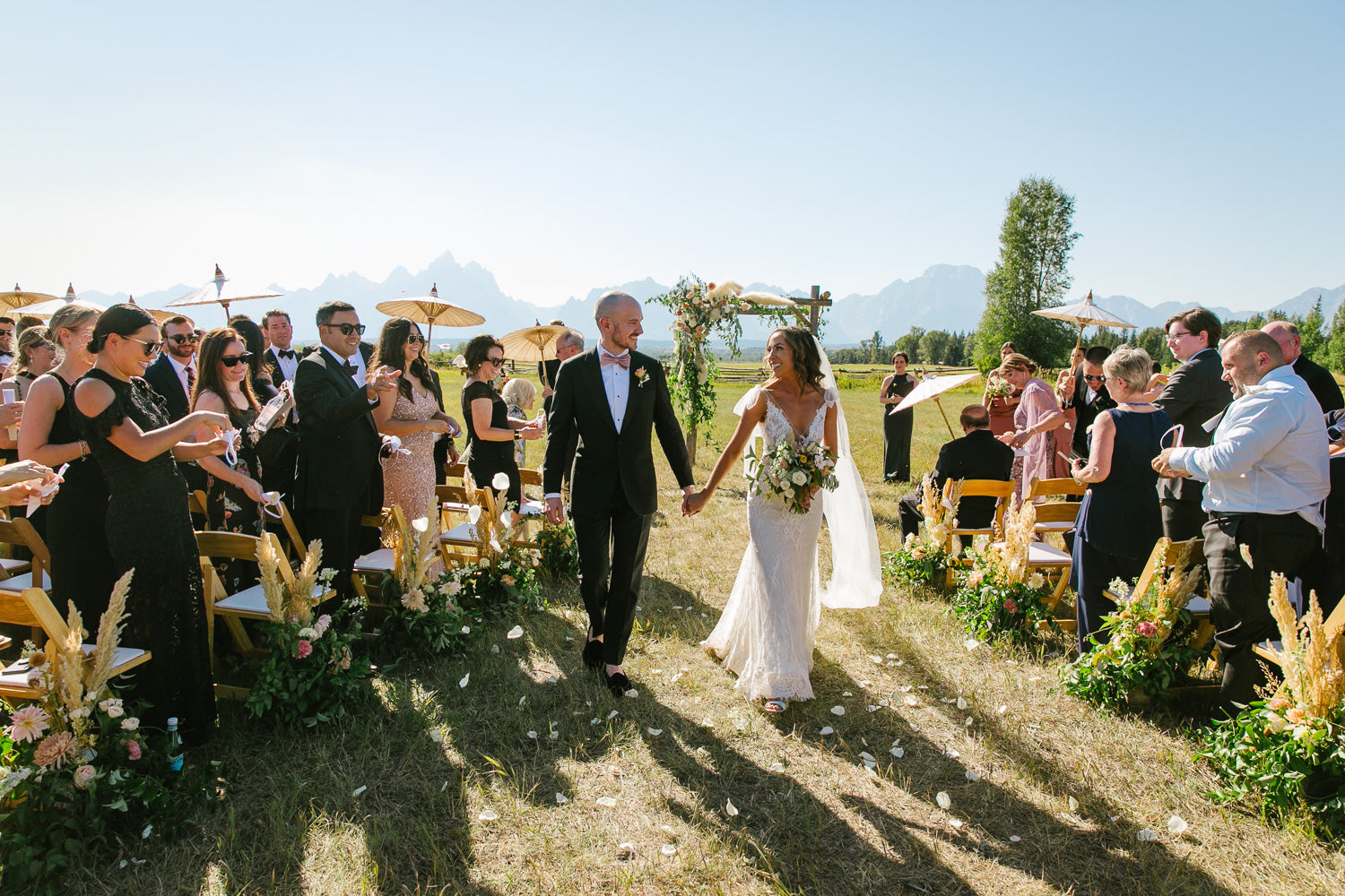 Outdoor wedding ceremony at Moosehead Ranch with view of Tetons. Jackson Hole wedding florist 